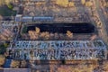 Abandoned derelict industrial greenhouse ruins in autumn, aerial