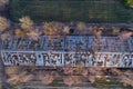 Abandoned derelict industrial greenhouse ruins in autumn, aerial