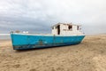 Marooned Fishing Boat Abandoned on the Oregon Coast Beach Royalty Free Stock Photo