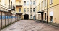 The abandoned deserted yard of a yellow town house