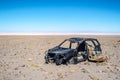 Abandoned, destroyed car in the desert of Atacama,