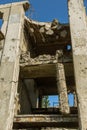 Abandoned destroyed by the explosion, bombing and shelling the destroyed building. Holes from shells, traces of bullets and splint Royalty Free Stock Photo