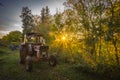 Abandoned old tractor sunset shot Royalty Free Stock Photo