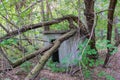 Abandoned dilapidated old brick building, broken glass from wooden frames, with ground overgrown with grass Royalty Free Stock Photo