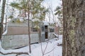 Abandoned dilapidated RV with door open in the woods in rural Northern Wisconsin in winter