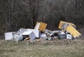 Abandoned electronic waste, household equipment in nature Royalty Free Stock Photo