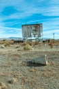 Abandoned drive in theatre and overgrown parking area Royalty Free Stock Photo