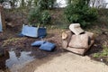 Abandoned and Dumped Sofa Armchair at the Garages Flytipped in the Rain