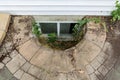 Abandoned egress window in a house basement Royalty Free Stock Photo