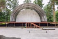 Abandoned empty aerial summer theater, stage in the park. Old building Royalty Free Stock Photo