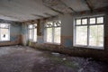 Abandoned empty hall with large windows Royalty Free Stock Photo