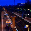 Abandoned empty suburban train station at night