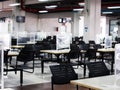 Abandoned empty tables chairs seats set in school canteen lunch room during COVID pandemic Royalty Free Stock Photo