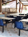 Abandoned empty tables chairs seats set in school canteen lunch room during COVID pandemic Royalty Free Stock Photo