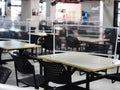 Abandoned empty tables chairs seats set in school canteen lunch room during COVID pandemic Royalty Free Stock Photo