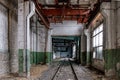 Abandoned empty train depot with old rusty bridge crane Royalty Free Stock Photo