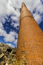 Abandoned Factory with Brick Smokestack and the Remnants of the Power Plant IV Royalty Free Stock Photo