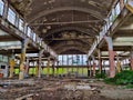 Abandoned factory building seeing from inside made of steel and concrete with missing windows
