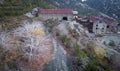 Abandoned factory buildings of asbestos mine over autumn landscape in Amiantos, Cyprus