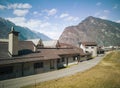 Abandoned factory front view in the valley. Glimpse of Biasca in Switzerland