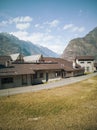 Abandoned factory front view in the valley. Glimpse of Biasca in Switzerland