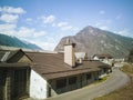 Abandoned factory front view in the valley. Glimpse of Biasca in Switzerland
