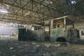 Abandoned factory hangar, where games are held in paintball Royalty Free Stock Photo