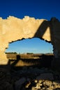 Abandoned factory, hole in the wall with landscape Royalty Free Stock Photo