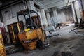 Abandoned Factory Interior with Rusty Forklift