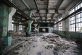 Abandoned factory. Large empty industrial hall with garbage Royalty Free Stock Photo