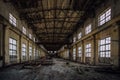 Abandoned factory. Large empty industrial hall with garbage Royalty Free Stock Photo