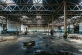 Abandoned factory. Large empty ruined industrial hall with broken remnants of equipment Royalty Free Stock Photo