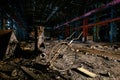Abandoned factory. Large empty ruined industrial hall with remnant of equipment at night Royalty Free Stock Photo
