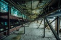 Abandoned factory. Old dusty conveyor belt in old corridor of glass brick Royalty Free Stock Photo