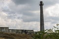 Abandoned factory pipe behind the fence