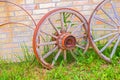 Abandoned faded wooden cart wheels together Royalty Free Stock Photo