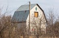 Abandoned farm house with blue roof in the countryside Royalty Free Stock Photo