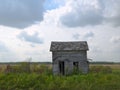 Abandoned Farm House with clouds on Minnesota Prairie Royalty Free Stock Photo