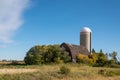 Abandoned farm yard with barn and silo Royalty Free Stock Photo