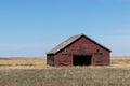 abandoned farmhouse barn on field in Alberta