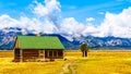 An abandoned Farmhouse at Mormon Row with in the background cloud covered Peaks of the Grand Tetons In Grand Tetons National Park Royalty Free Stock Photo