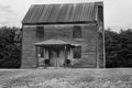 Abandoned Farmhouse in a Rural Field