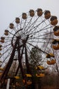 Abandoned Ferris Wheel in amusement park of ghost town Pripyat in Chernobyl Exclusion Zone, Ukraine Royalty Free Stock Photo