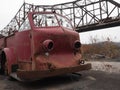 Abandoned fire engine with bridge in background