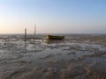 Abandoned fisherman boat in low tide