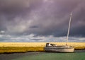 Abandoned fishing boat on the Arctic shore.