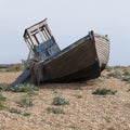 An abandoned fishing boat on Dungeness beach Royalty Free Stock Photo
