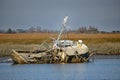 Old abandoned fishing boat sinking in the water