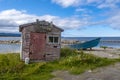 Abandoned Fishing Shack and Boat by the Shore in Newfoundland