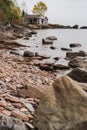 Abandoned fishing shacks or cabins, on Two Fishhouse Beach along Lake Superior shoreline in Minnesota, during fall